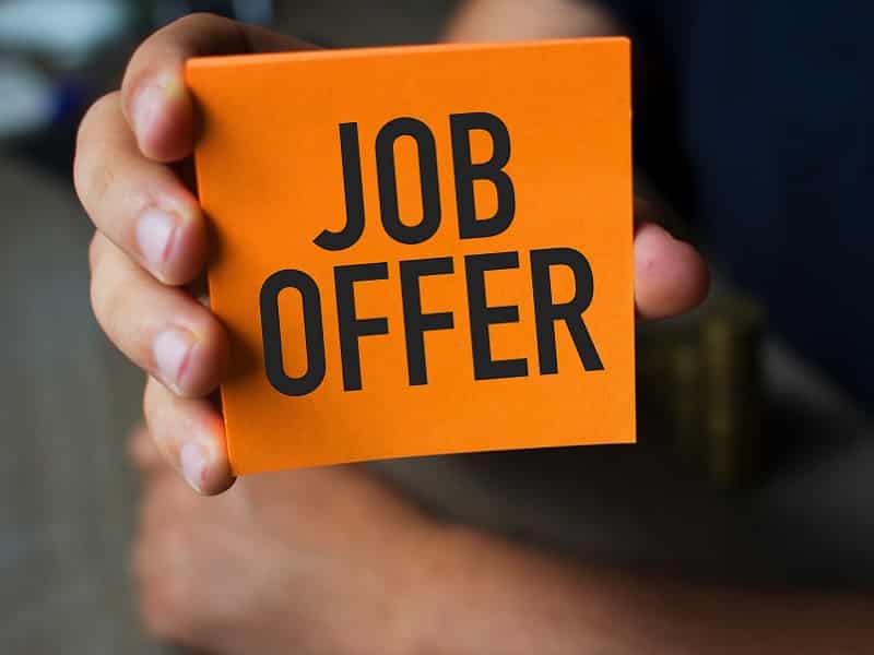 holding card with job offer
