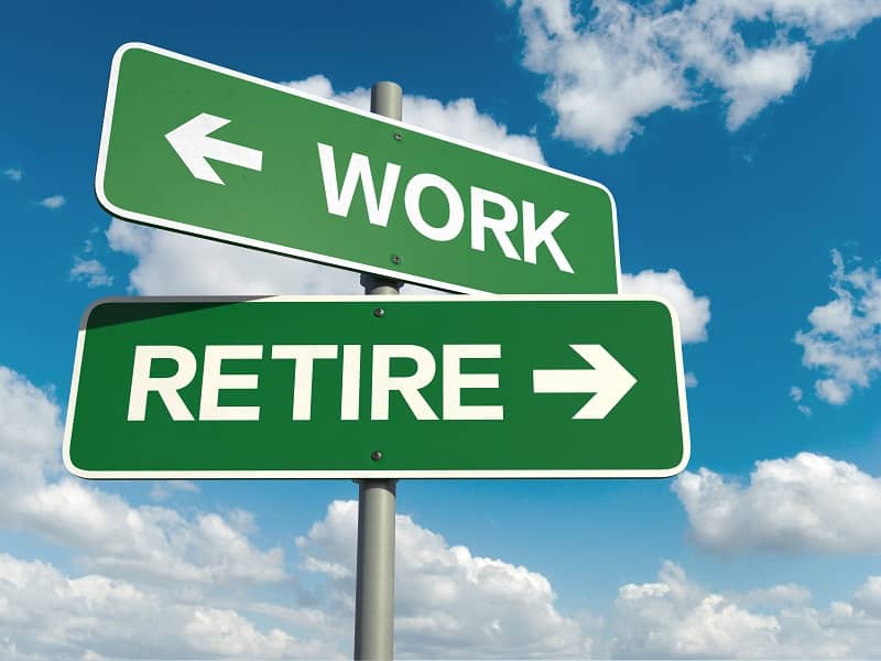 Sign pointing to work and retire