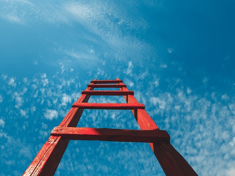 red ladder up to sky